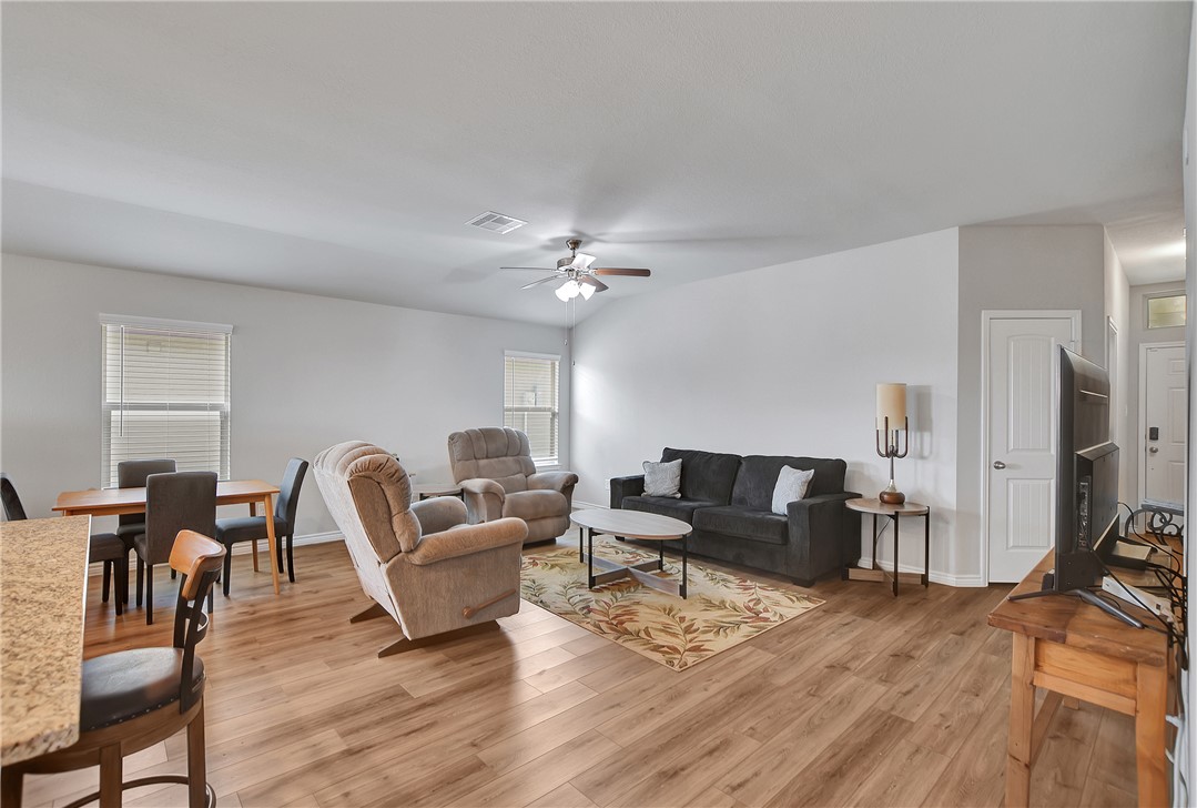 909 Davy Street Brenham, TX 77833 - Photo 11 of 35 Living room featuring light wood-style flooring and a ceiling fan