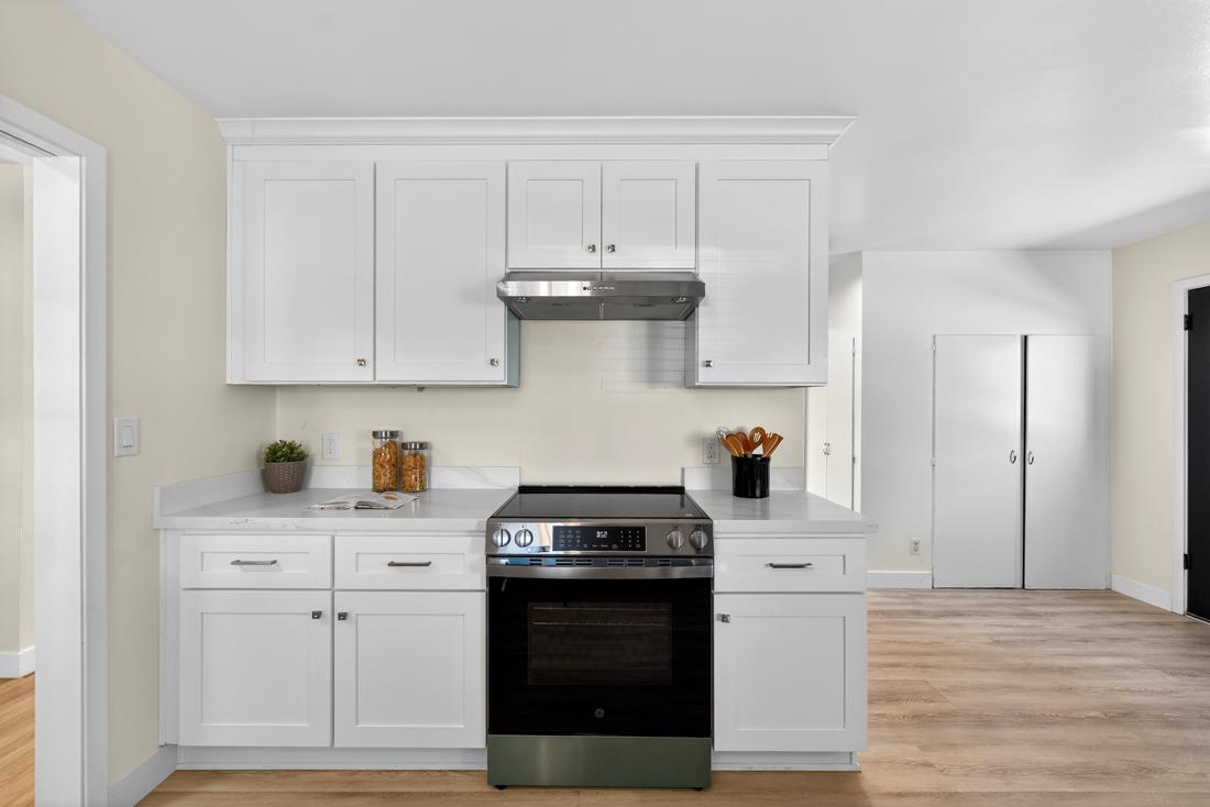 2991-2987 Almaden Road San Jose, CA 95125 - Photo 24 of 60 a kitchen with white cabinets and appliances