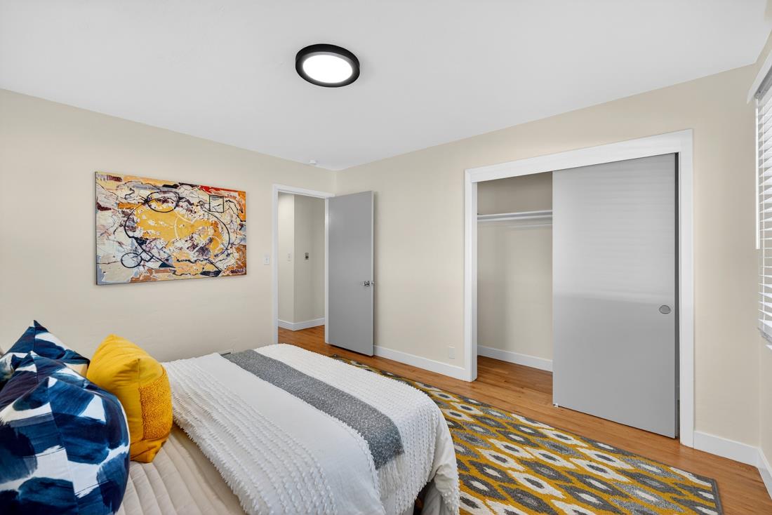 2991-2987 Almaden Road San Jose, CA 95125 - Photo 27 of 60 a bedroom with a bed and a painting on the wall