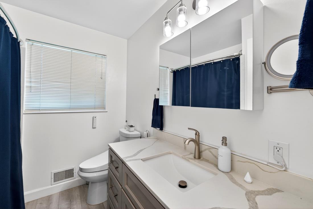 2991-2987 Almaden Road San Jose, CA 95125 - Photo 54 of 60 a bathroom with a sink a toilet and a mirror