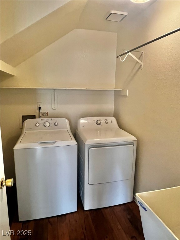5304 Harmony Street, Unit HOME Las Vegas, NV 89107 - Photo 11 of 17 Washroom featuring independent washer and dryer and dark wood-style floors