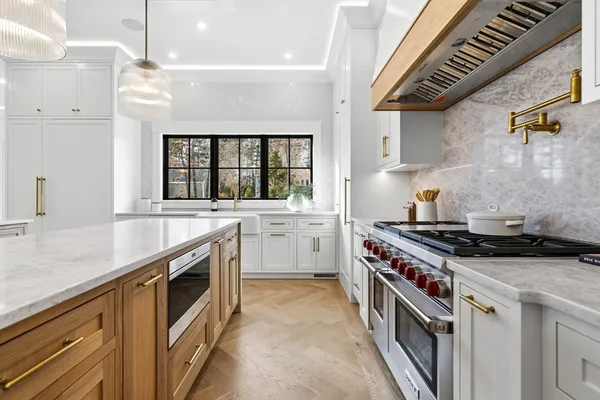 a kitchen with a stove and a sink