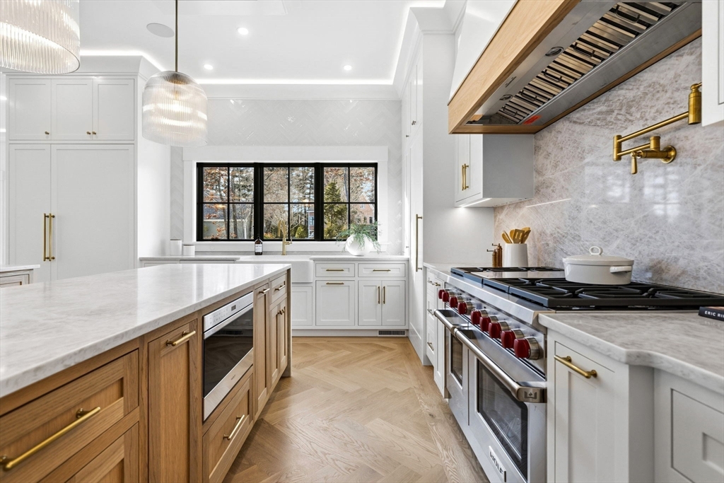9 Tuttle Lane Lynnfield, MA 01940 - Photo 11 of 42 a kitchen with a stove and a sink