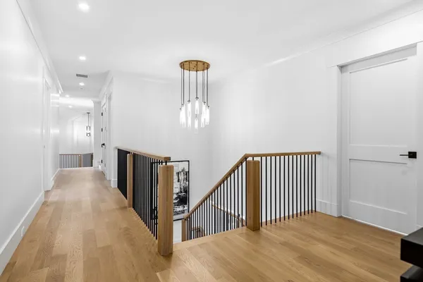 a view of a hallway with a chandelier