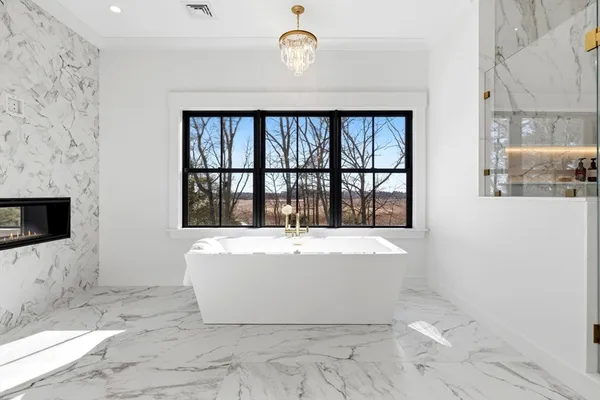 a white bath tub sitting in a bathroom