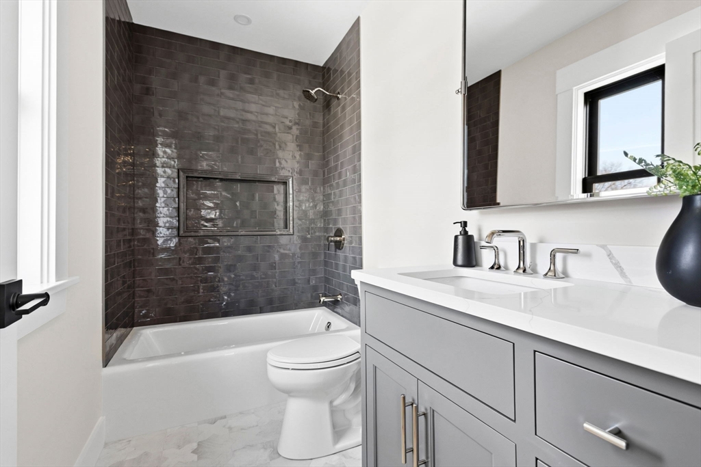 9 Tuttle Lane Lynnfield, MA 01940 - Photo 30 of 42 a bathroom with a sink a toilet and shower