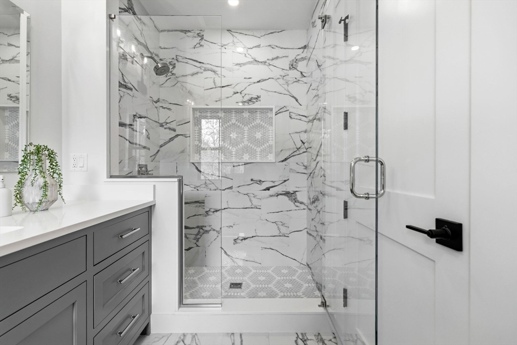 9 Tuttle Lane Lynnfield, MA 01940 - Photo 32 of 42 a bathroom with a shower and vanity