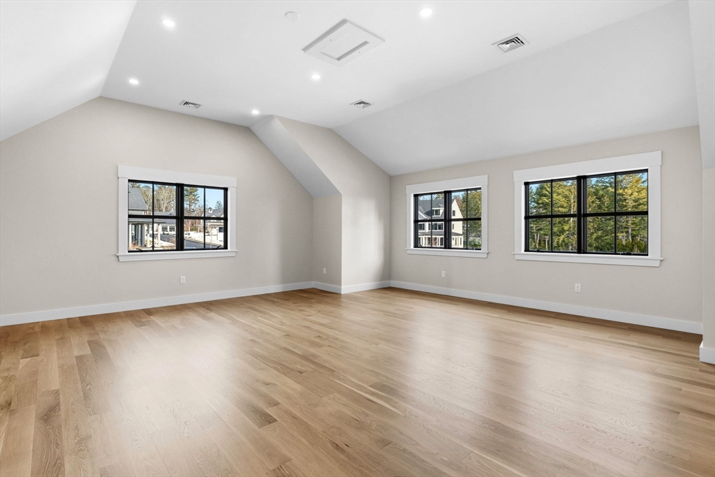 9 Tuttle Lane Lynnfield, MA 01940 - Photo 33 of 42 an empty room with wooden floor and windows