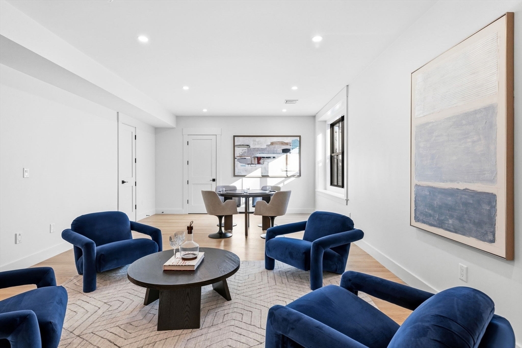 9 Tuttle Lane Lynnfield, MA 01940 - Photo 37 of 42 a living room with furniture a rug and a window