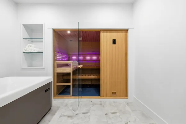 a view of a room with furniture and window