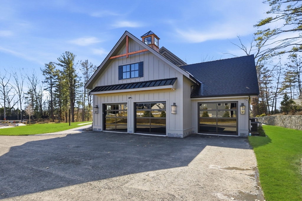 9 Tuttle Lane Lynnfield, MA 01940 - Photo 41 of 42 a front view of a house with garden