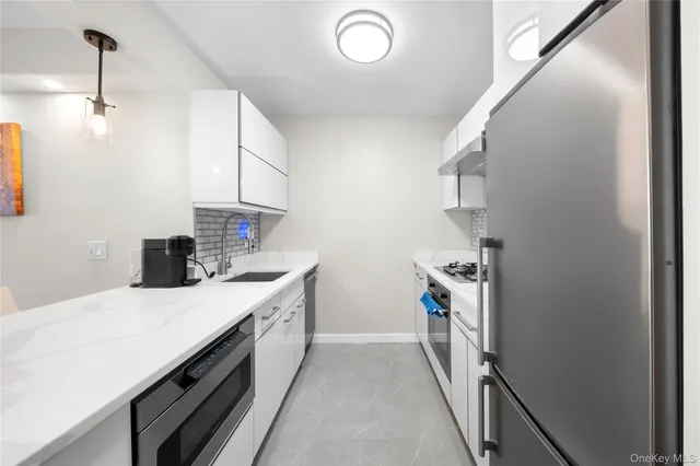 a kitchen with a stove and a sink