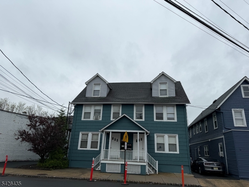 526 Morris Avenue Summit, NJ 07901 - Photo 1 of 3 a front view of a residential apartment building with a yard