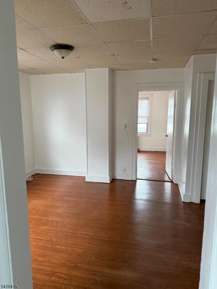 526 Morris Avenue Summit, NJ 07901 - Photo 2 of 3 a view of empty room with wooden floor and fan