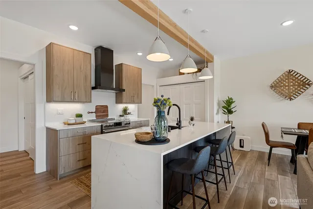 a kitchen with a table and chairs in it