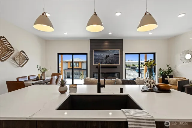 a living room with furniture and a chandelier