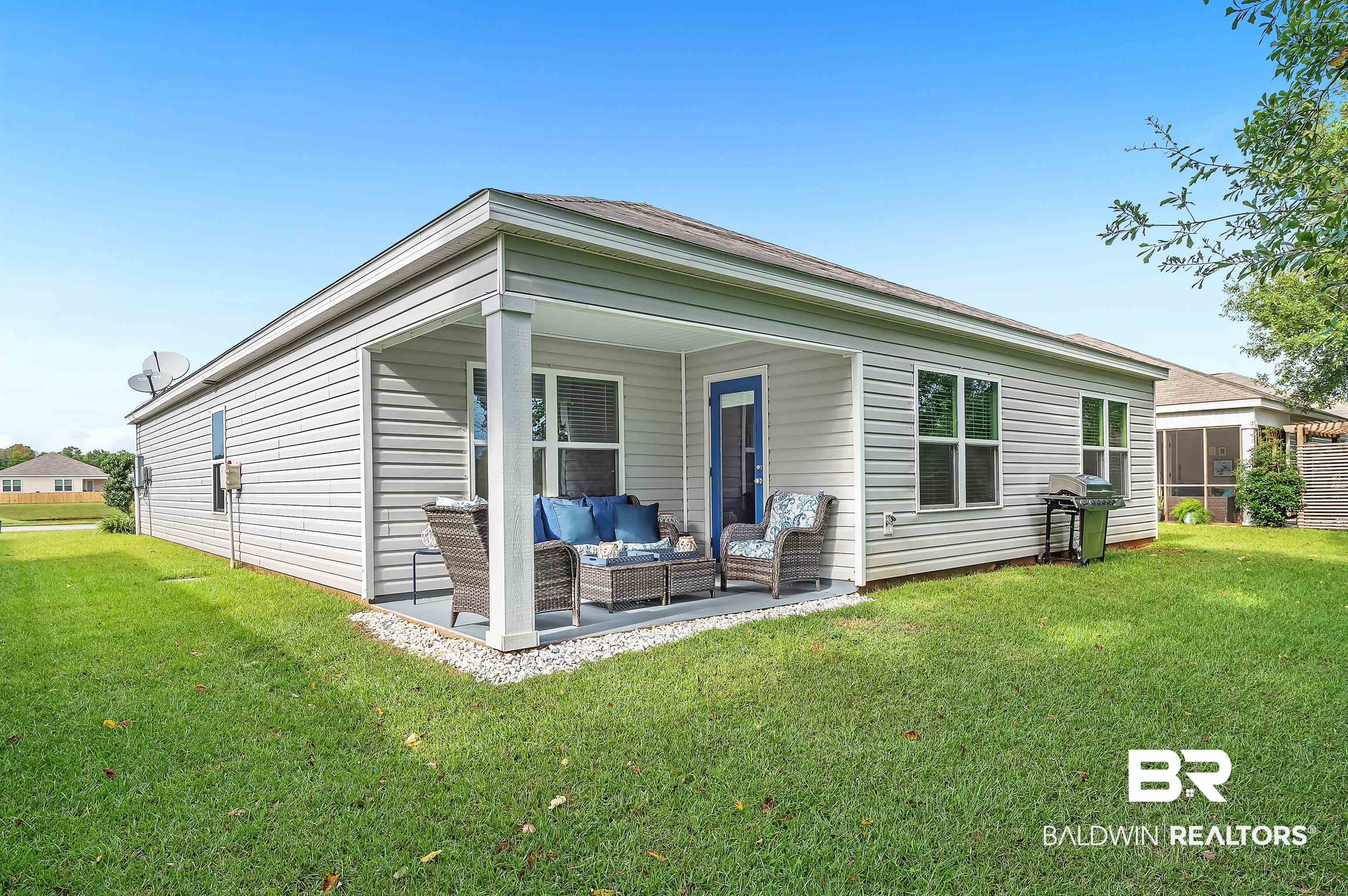 17985 Lewis Smith Drive Foley, AL 36535 - Photo 45 of 56 Rear view of house with an outdoor living space and a yard