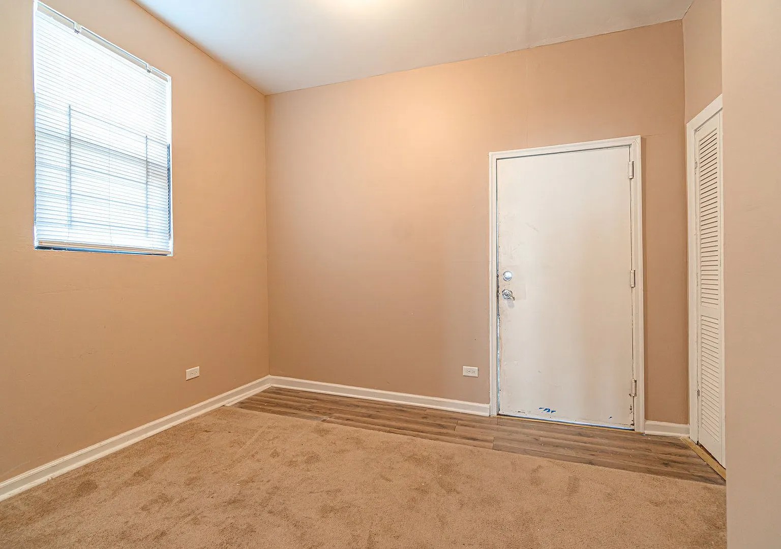 1144 West 68th Street, Unit 1 Chicago, IL 60621 - Photo 11 of 14 an empty room with windows and closet