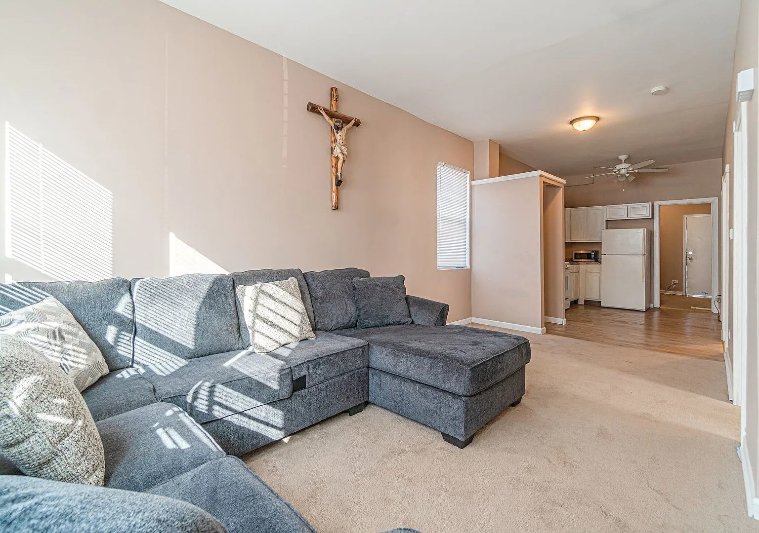 1144 West 68th Street, Unit 1 Chicago, IL 60621 - Photo 5 of 14 a large living room with a couch and a ceiling fan