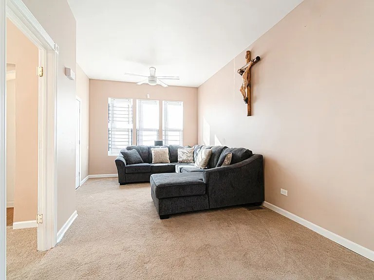 1144 West 68th Street, Unit 1 Chicago, IL 60621 - Photo 6 of 14 a living room with furniture and a window