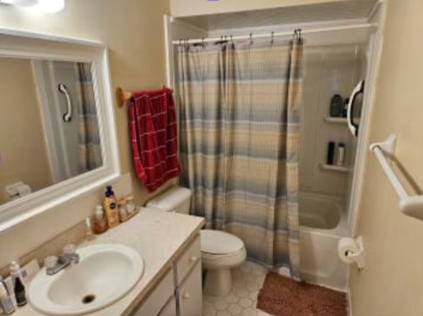 348 Tarpon Avenue Fernandina Beach, FL 32034 - Photo 11 of 44 a bathroom with a sink toilet and shower