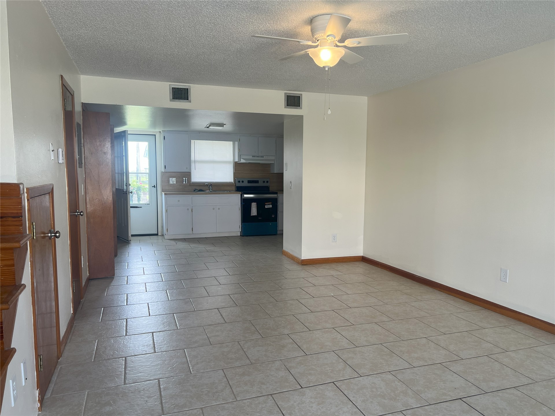 348 Tarpon Avenue Fernandina Beach, FL 32034 - Photo 14 of 44 a large kitchen with cabinets and stainless steel appliances