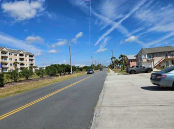 348 Tarpon Avenue Fernandina Beach, FL 32034 - Photo 28 of 44 a view of a street with a cars parked in front of it