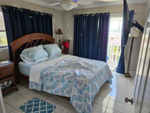 348 Tarpon Avenue Fernandina Beach, FL 32034 - Photo 7 of 44 a bedroom with a bed and a window