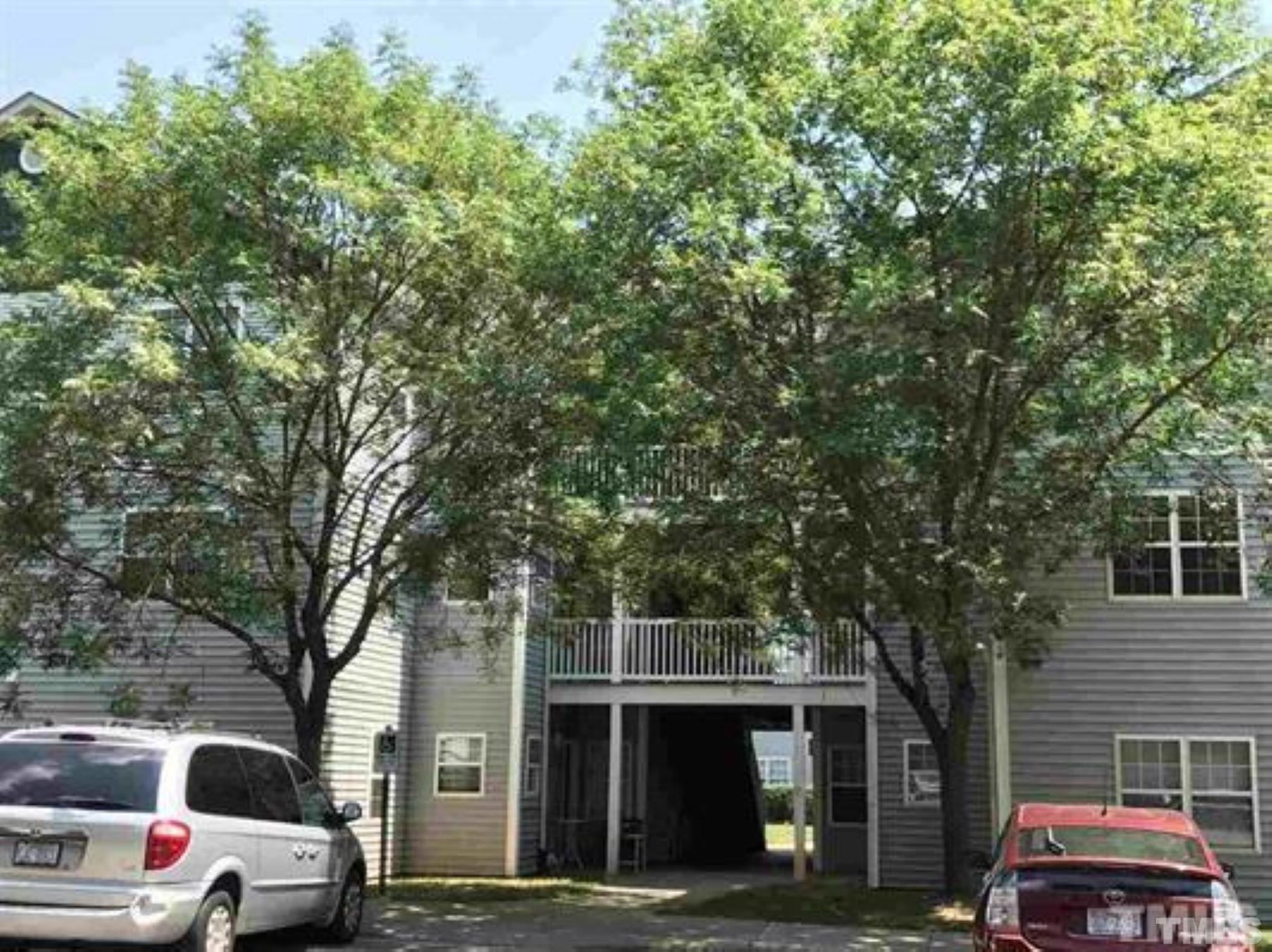 1911 Wolf Tech Lane, Unit 204C Raleigh, NC 27603 - Photo 2 of 18 a view of street with parked cars