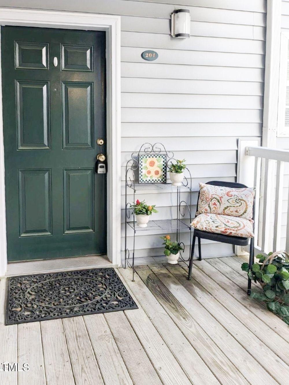 1911 Wolf Tech Lane, Unit 204C Raleigh, NC 27603 - Photo 3 of 18 a view of a entryway door of the house