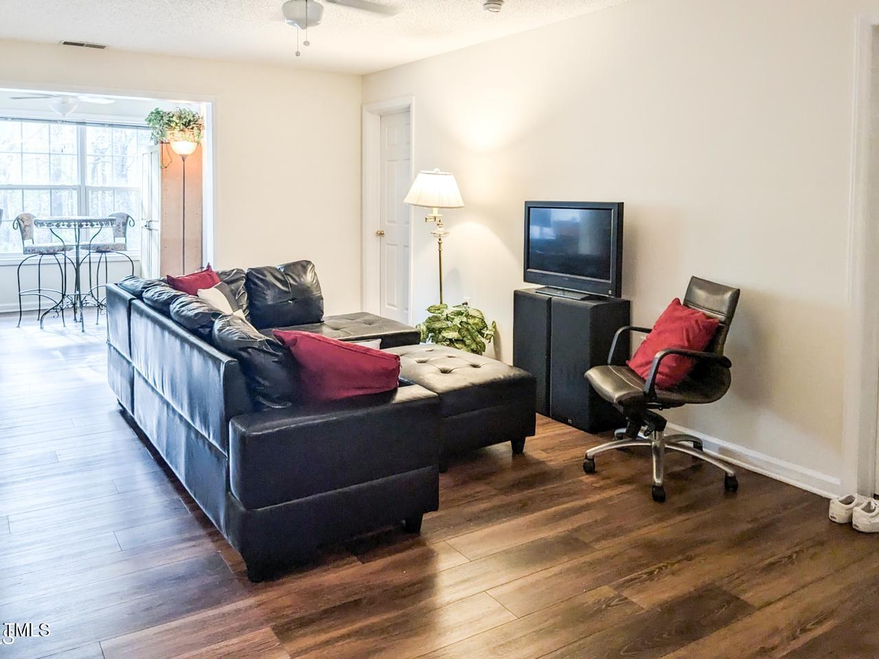 1911 Wolf Tech Lane, Unit 204C Raleigh, NC 27603 - Photo 6 of 18 a living room with furniture