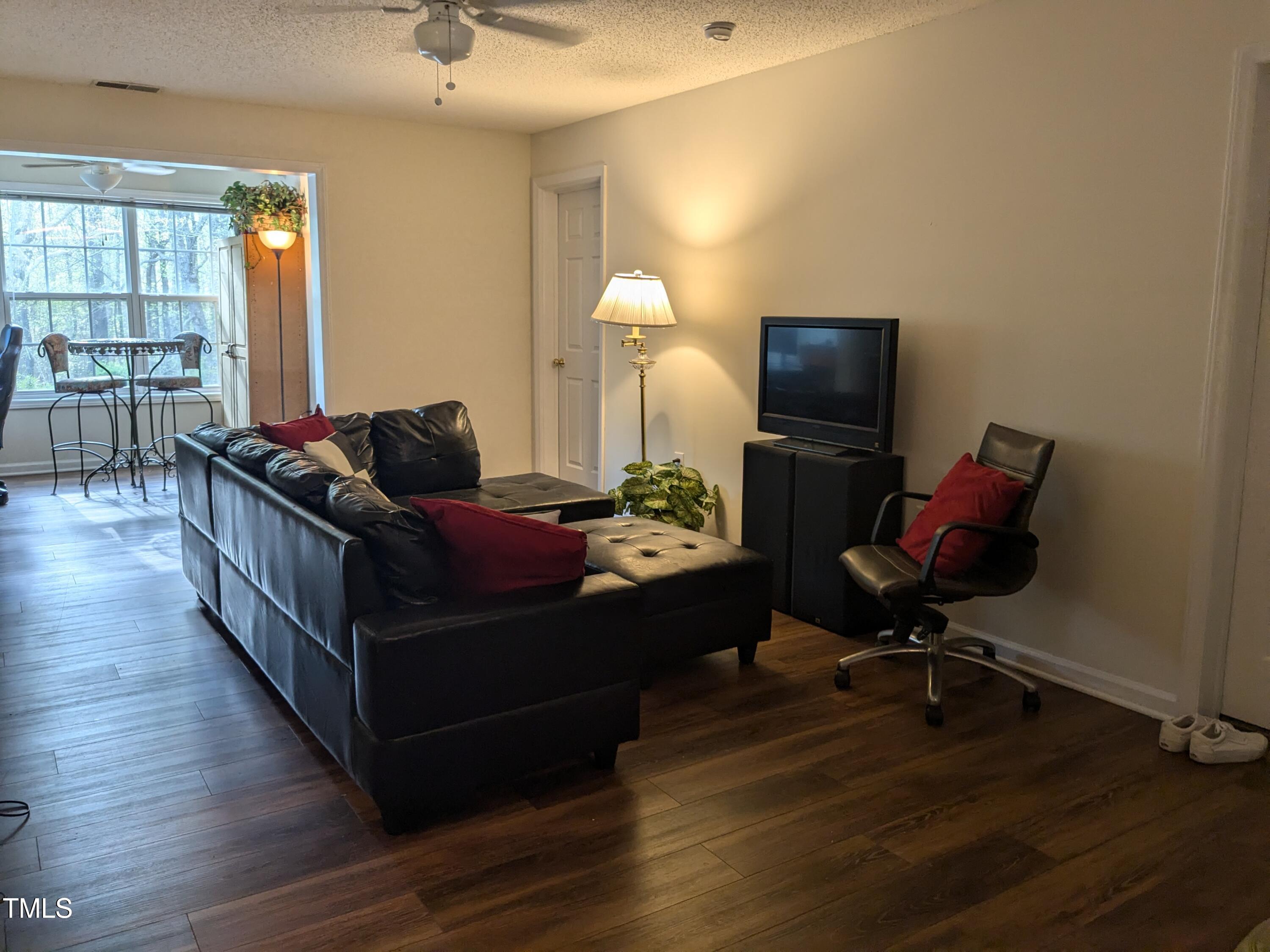 1911 Wolf Tech Lane, Unit 204C Raleigh, NC 27603 - Photo 9 of 18 a living room with furniture