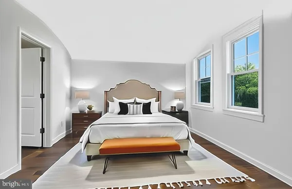 a bed room with a bed and a window