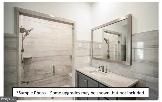 a picture of a bathroom with a shower