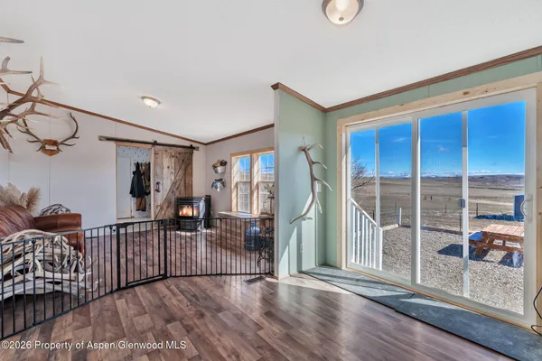 a view of livingroom with furniture and floor to ceiling window