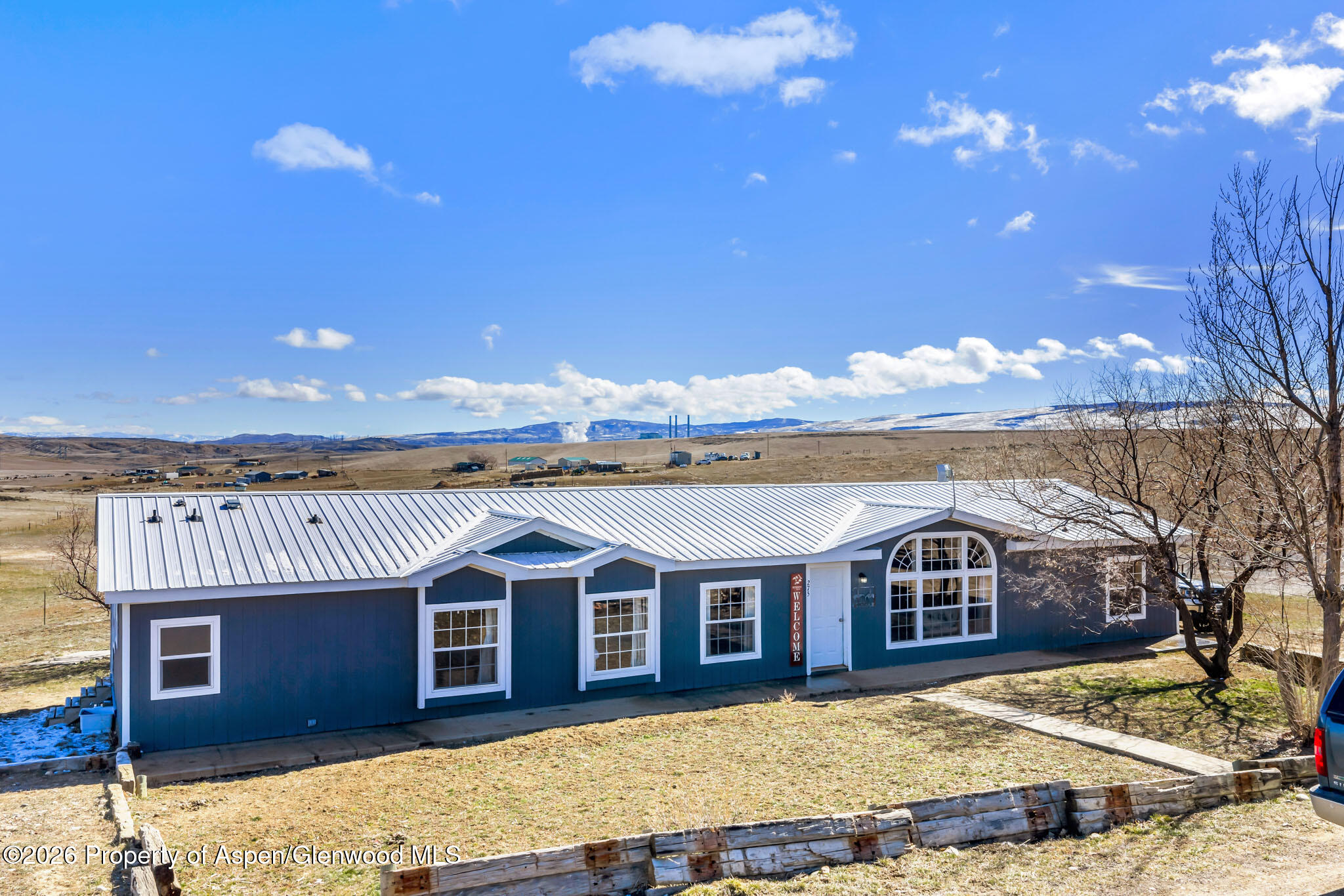 275 Roberts Road Craig, CO 81625 - Photo 2 of 47 a front view of a house with a yard