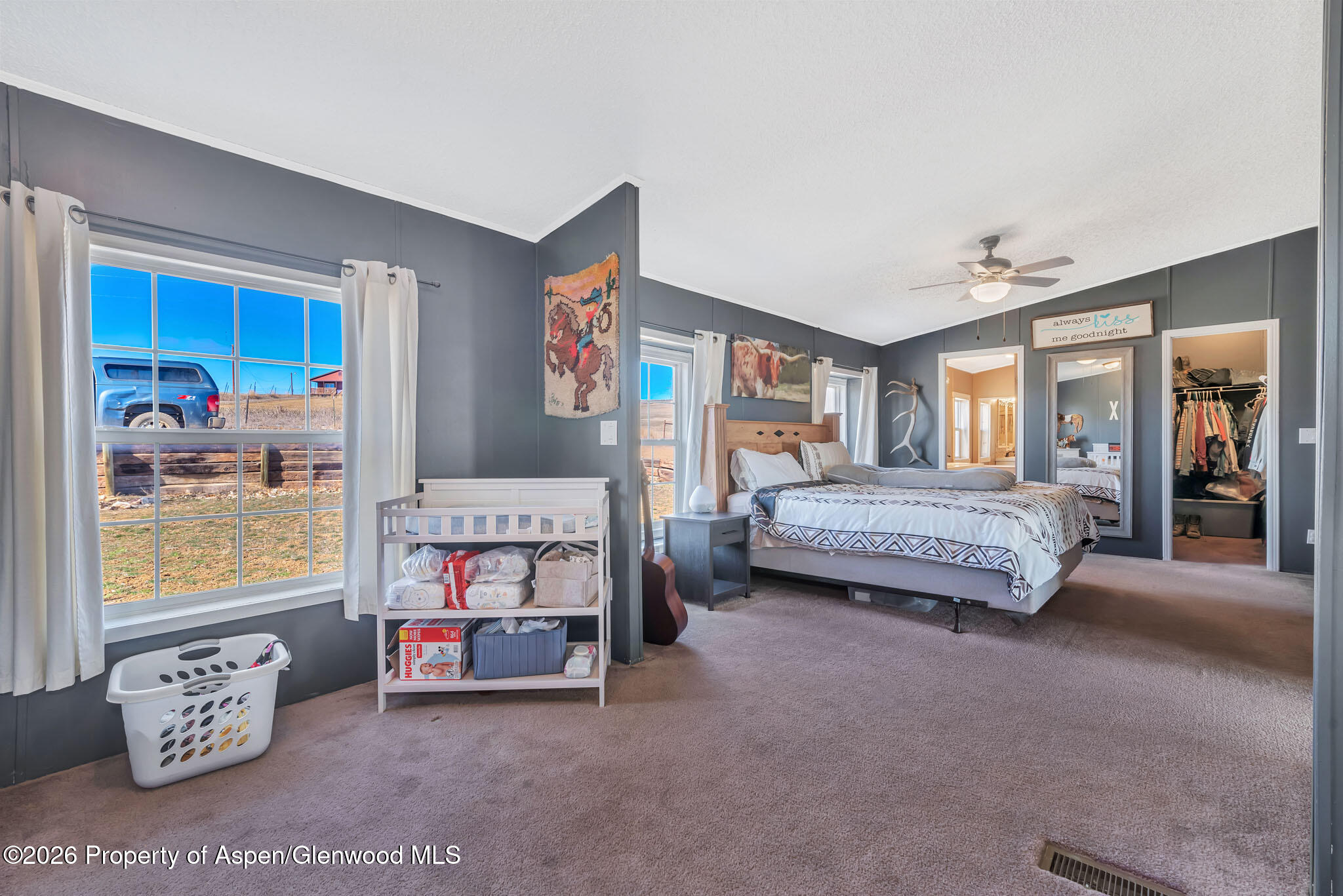 275 Roberts Road Craig, CO 81625 - Photo 23 of 47 a bedroom with furniture and a large window