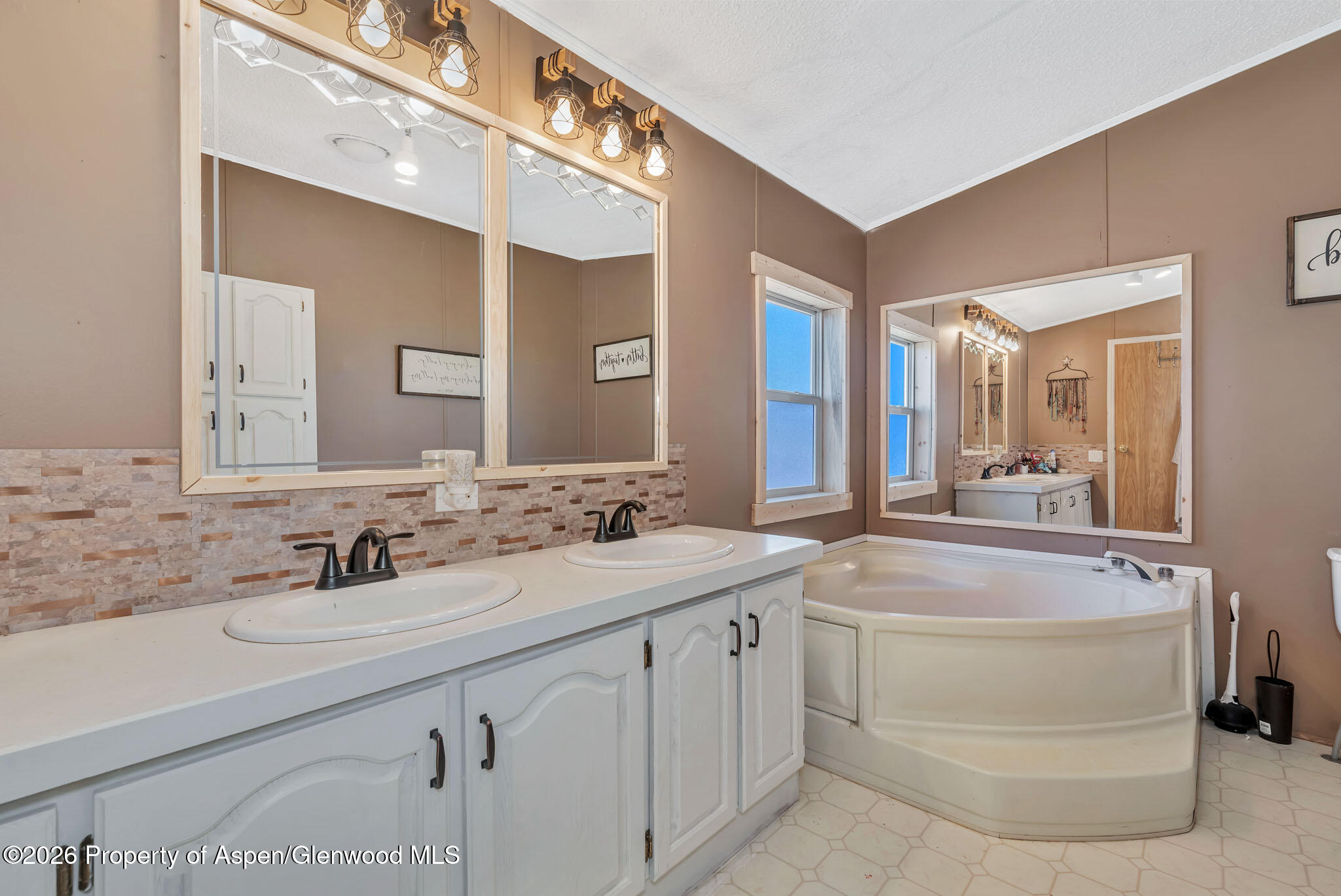 275 Roberts Road Craig, CO 81625 - Photo 25 of 47 a bathroom with a sink and a mirror