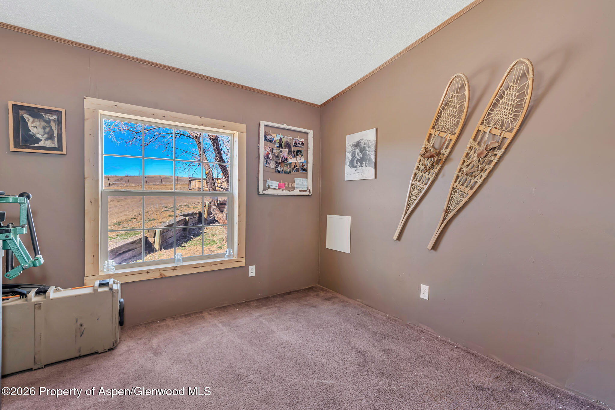275 Roberts Road Craig, CO 81625 - Photo 28 of 47 a view of an empty room with a window