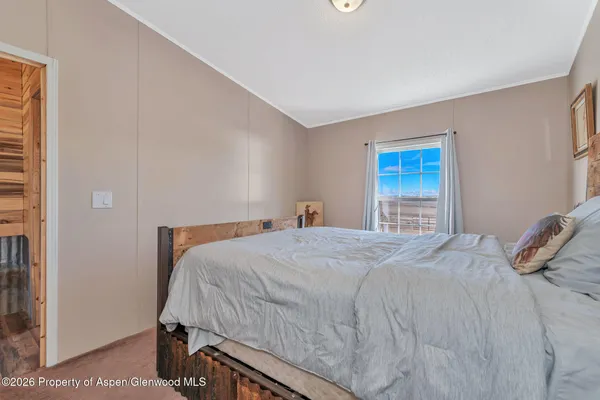 a bedroom with a bed and a cabinets