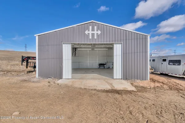 a view of a garage with parked cars