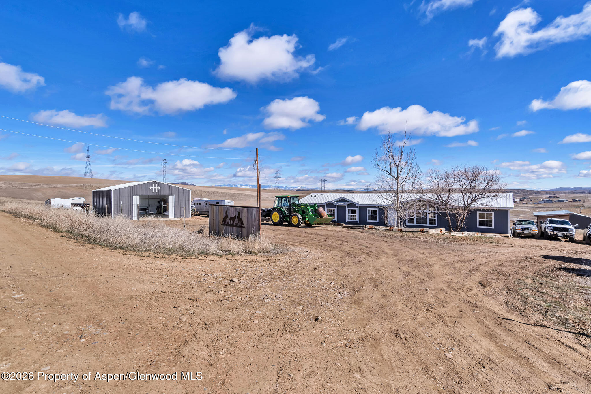 275 Roberts Road Craig, CO 81625 - Photo 4 of 47 a view of a house with a yard