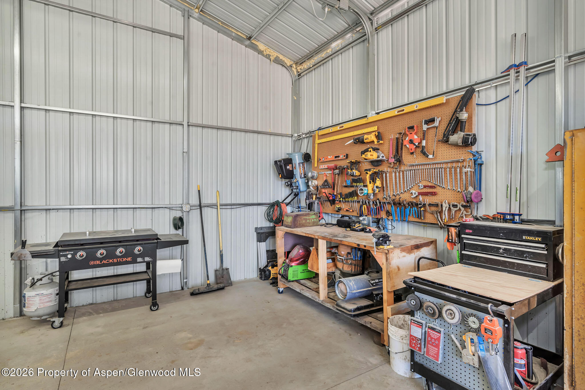 275 Roberts Road Craig, CO 81625 - Photo 42 of 47 a utility room with dryer and bicycles