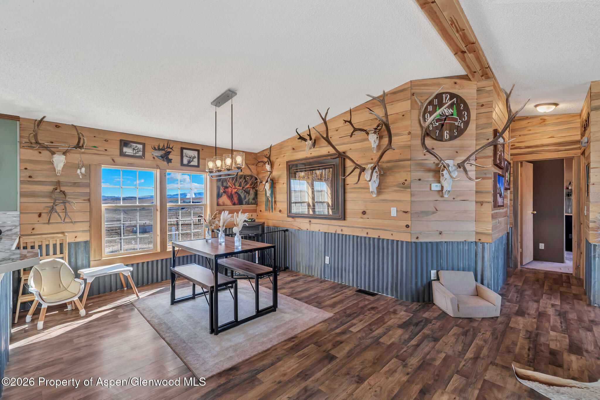 275 Roberts Road Craig, CO 81625 - Photo 9 of 47 a living room with furniture and a large window