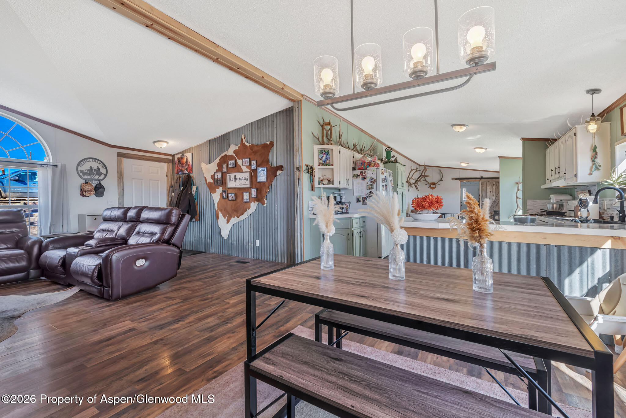 275 Roberts Road Craig, CO 81625 - Photo 10 of 47 a dining room with furniture and wooden floor