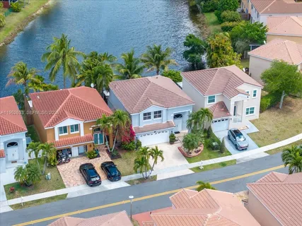 an aerial view of house with yard