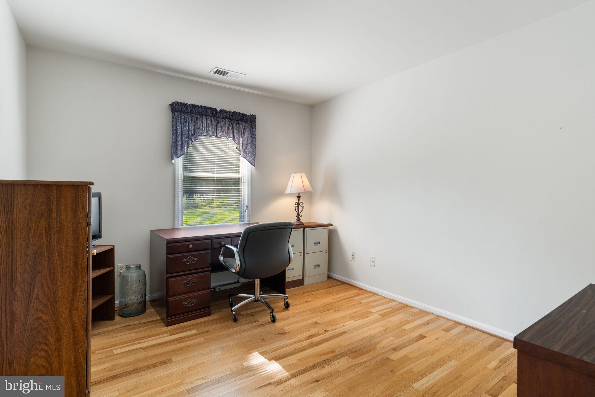 161 Troy Road Louisa, VA 23093 - Photo 30 of 60 a view of workspace with wooden floor windows