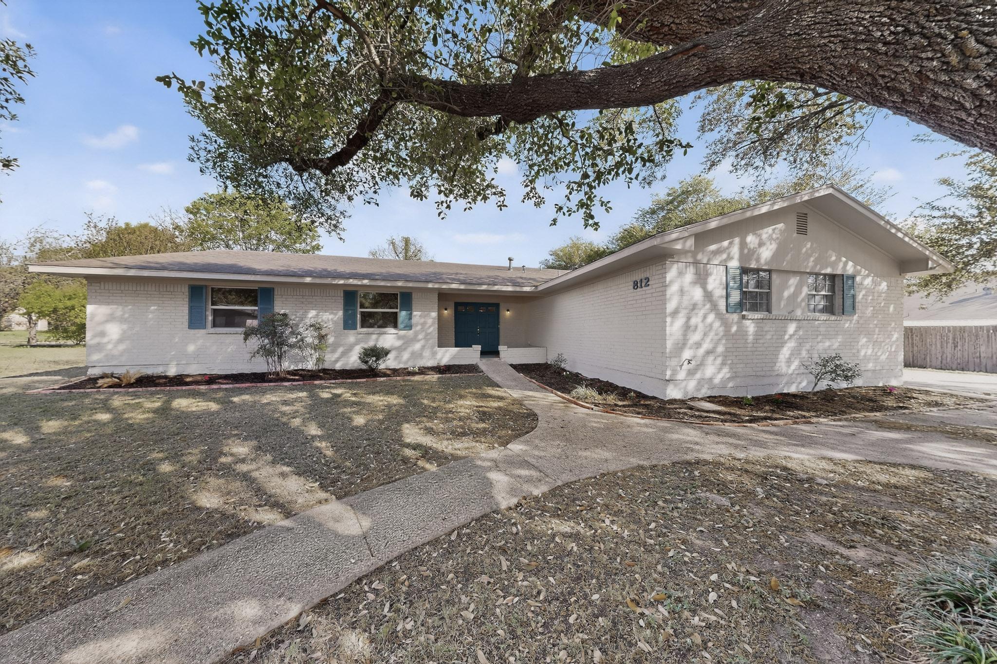 Ranch-style home with brick siding