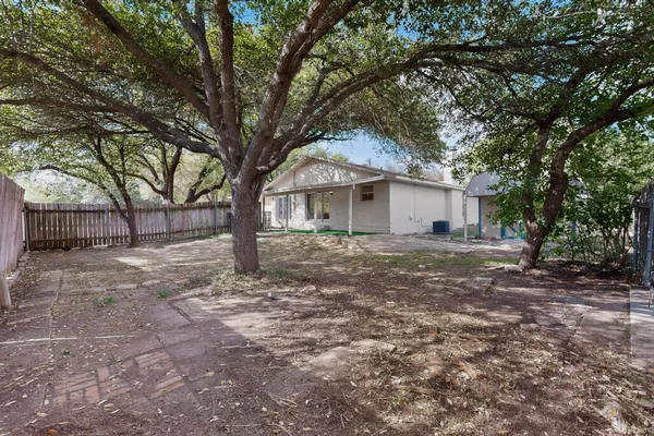 a view of a house with a yard and garage