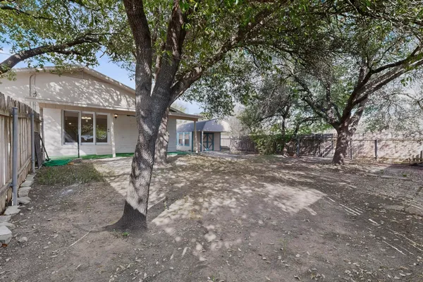 a view of an house with backyard porch and entertaining space